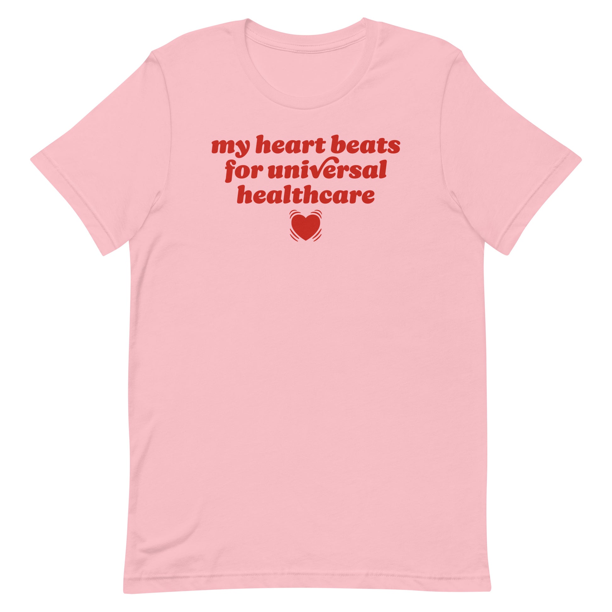 Pink unisex t-shirt featuring red typography reading “my heart beats for universal healthcare,” a progressive Valentine design supporting healthcare access and people-first policy values.