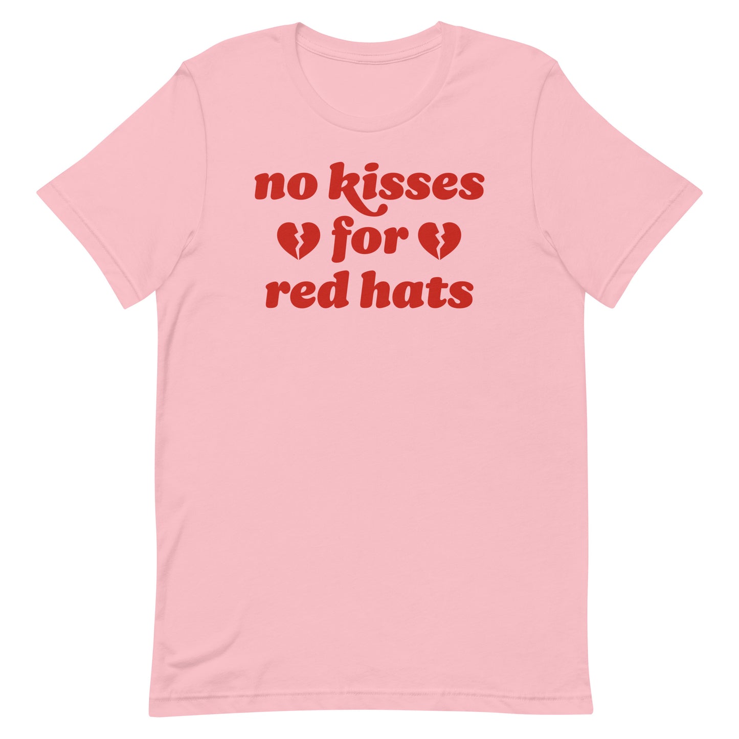 Unisex t-shirt in soft pink featuring the phrase “no kisses for red hats” with broken heart icons, an anti-MAGA Valentine statement in progressive apparel.