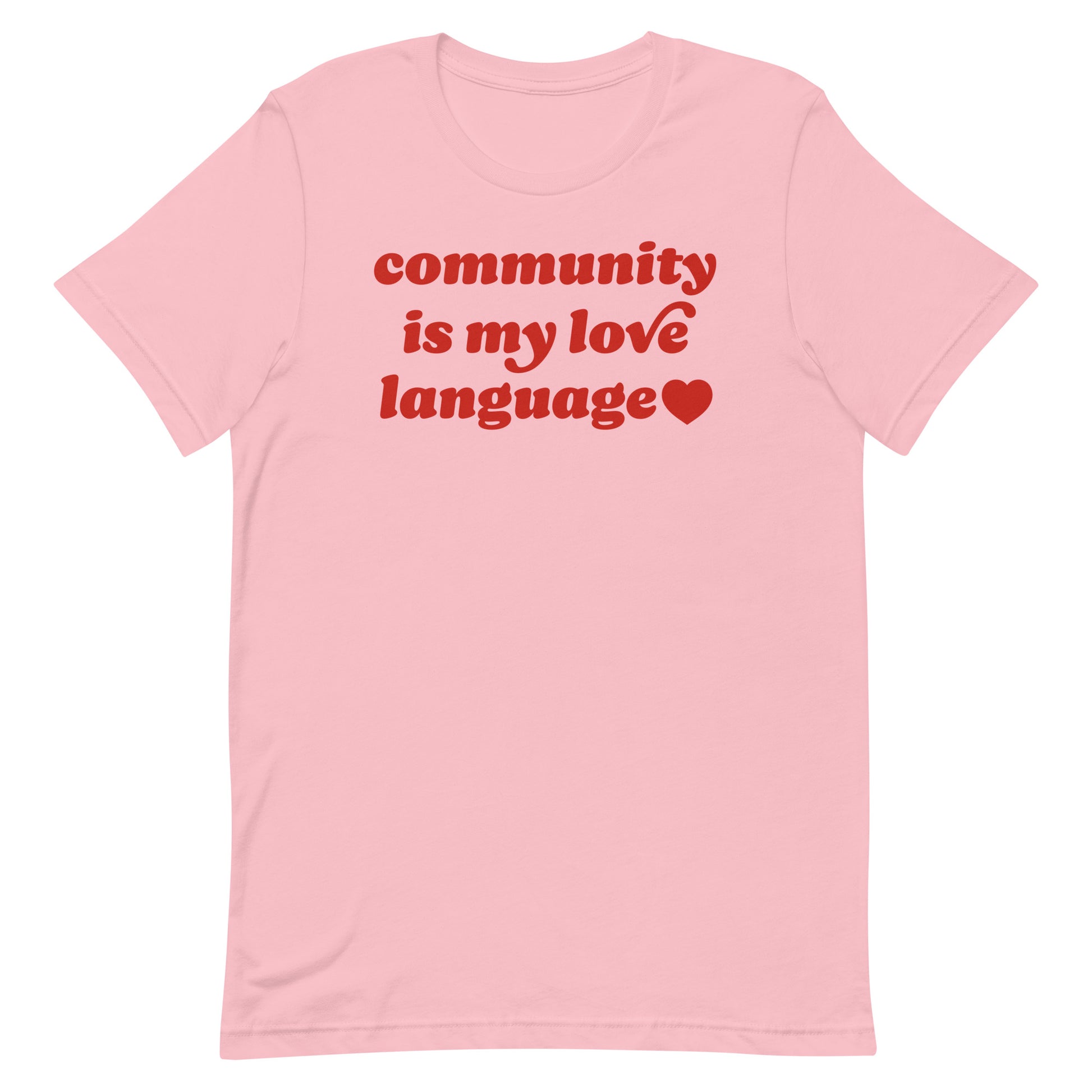 Unisex t-shirt in soft pink featuring retro red lettering and heart icon reading “community is my love language,” a progressive Valentine design centered on political activism.
