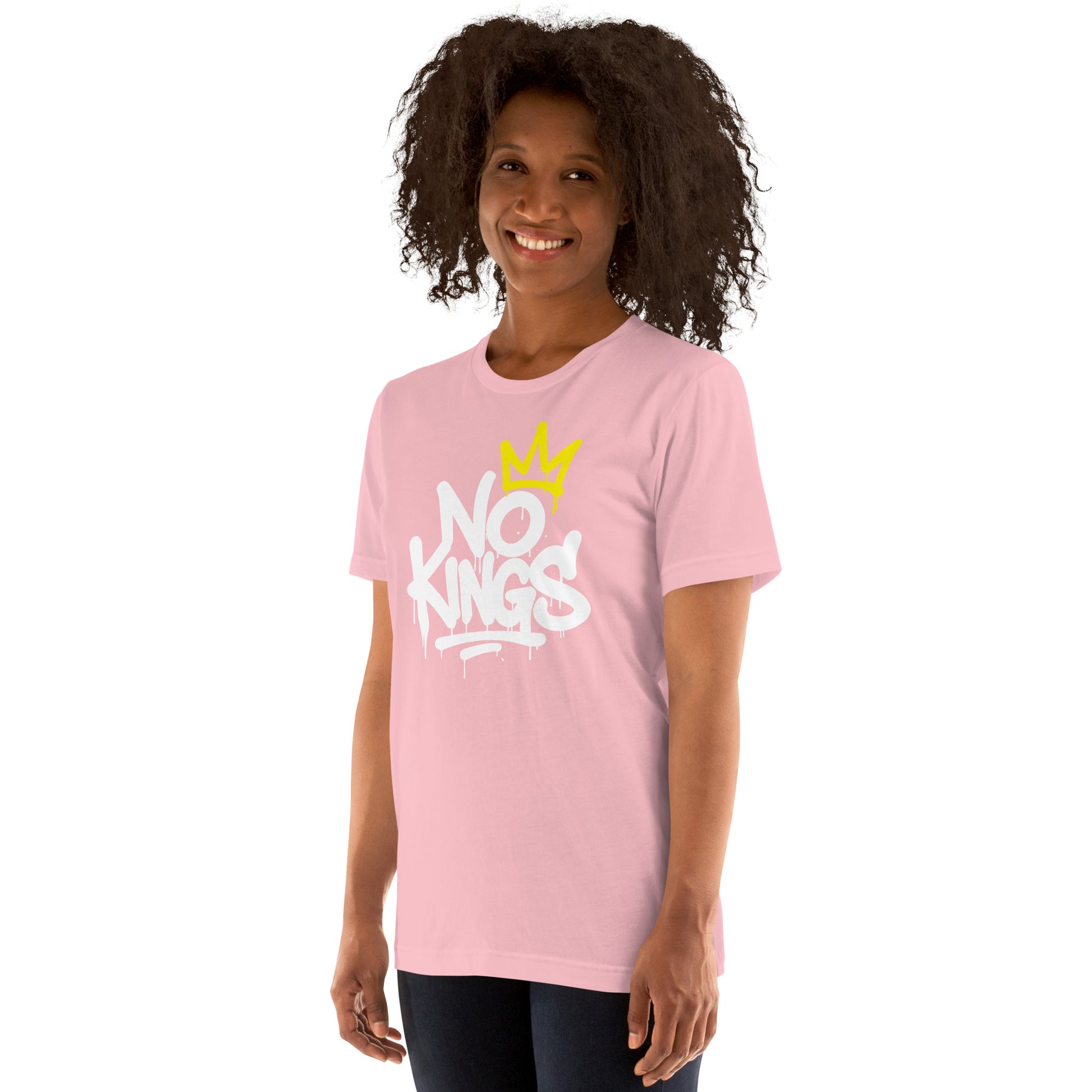 Lifestyle Image: Female Model wearing graffiti-style No Kings in America unisex t-shirt with anti-authoritarian message