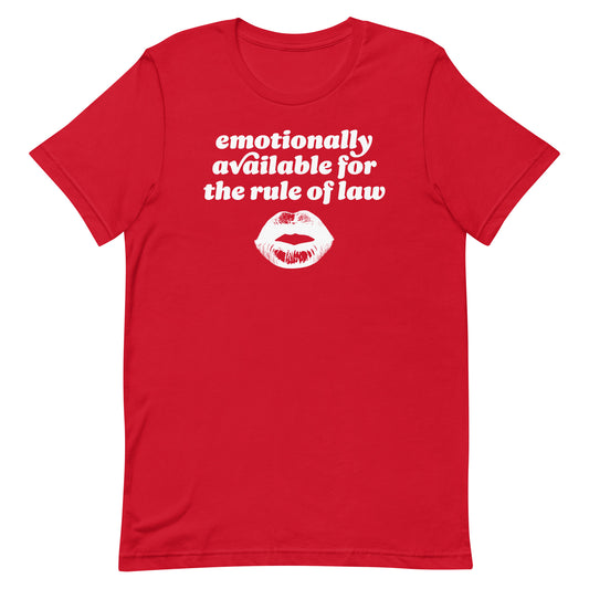 Red unisex t-shirt showcasing playful rounded text and kiss graphic with the phrase “emotionally available for the rule of law,” a justice-forward Valentine statement.
