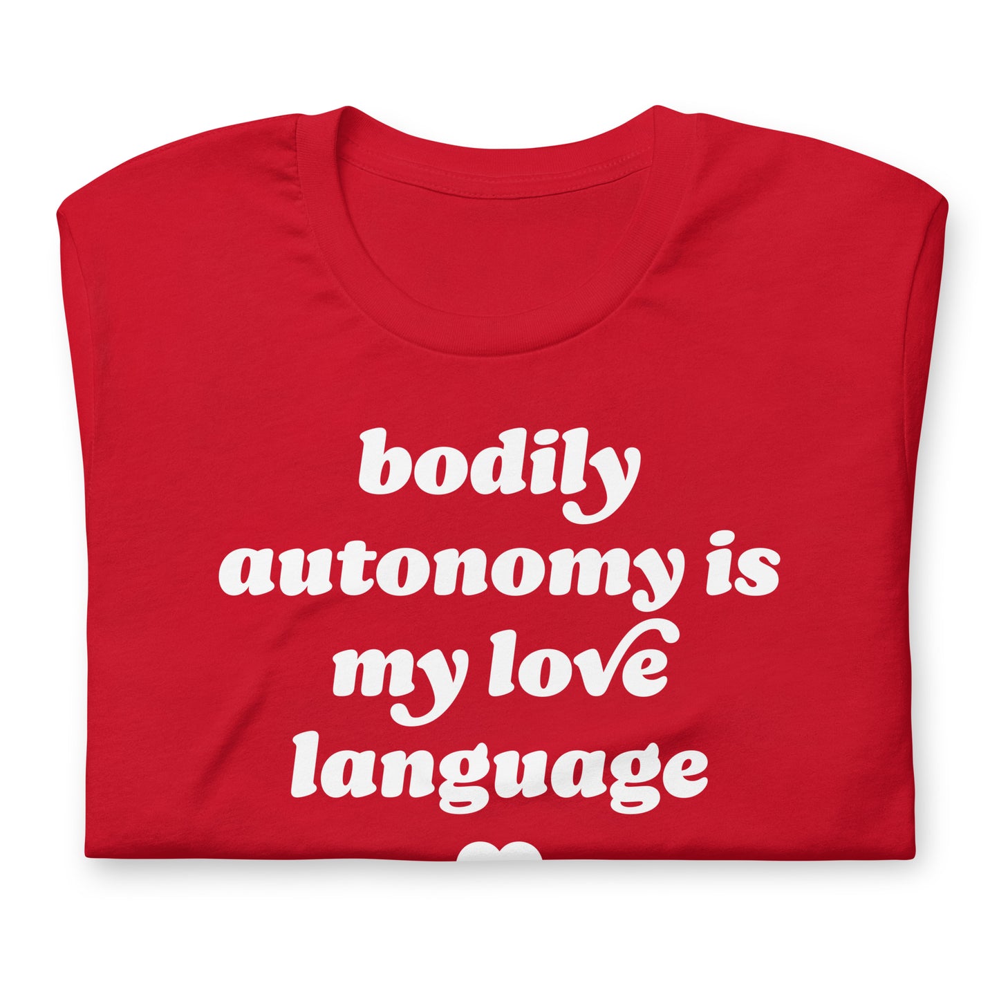 Folded red unisex t-shirt showing close-up of “bodily autonomy is my love language” print in bold vintage lettering, progressive apparel from Blue Wave USA.