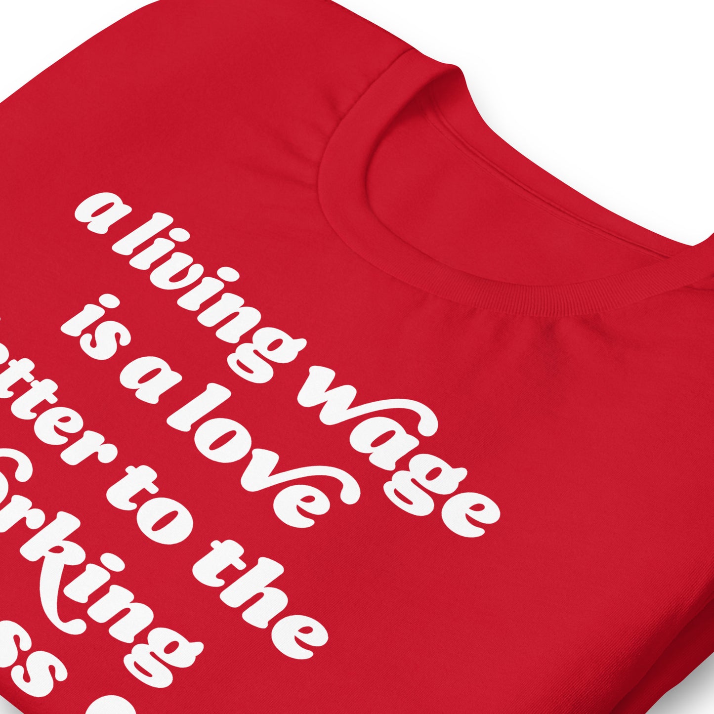 Close-up of red Valentine t-shirt highlighting curved lettering and heart graphics forming the phrase “a living wage is a love letter to the working class,” by Blue Wave USA.