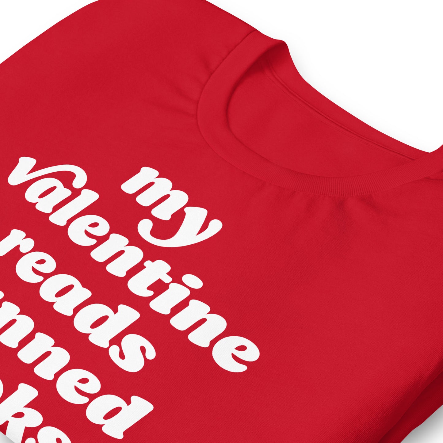 Close-up of unisex t-shirt neckline showing “my valentine reads banned books” typography and heart graphic, highlighting a book-banning protest Valentine message.