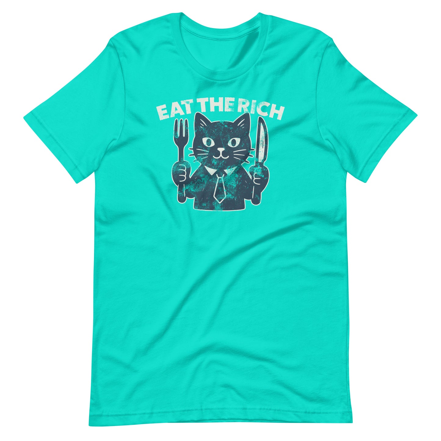 Teal t-shirt displaying a playful cat illustration with cutlery and the phrase “Eat the Rich,” blending political satire with cartoon-style artwork.