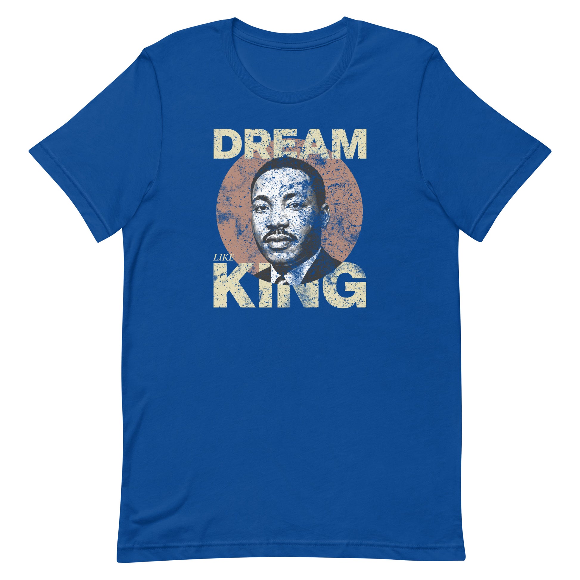 Royal blue unisex t-shirt featuring the distressed “DREAM LIKE KING” lettering with an MLK portrait in a textured circle. Blue Wave USA civil-rights apparel.