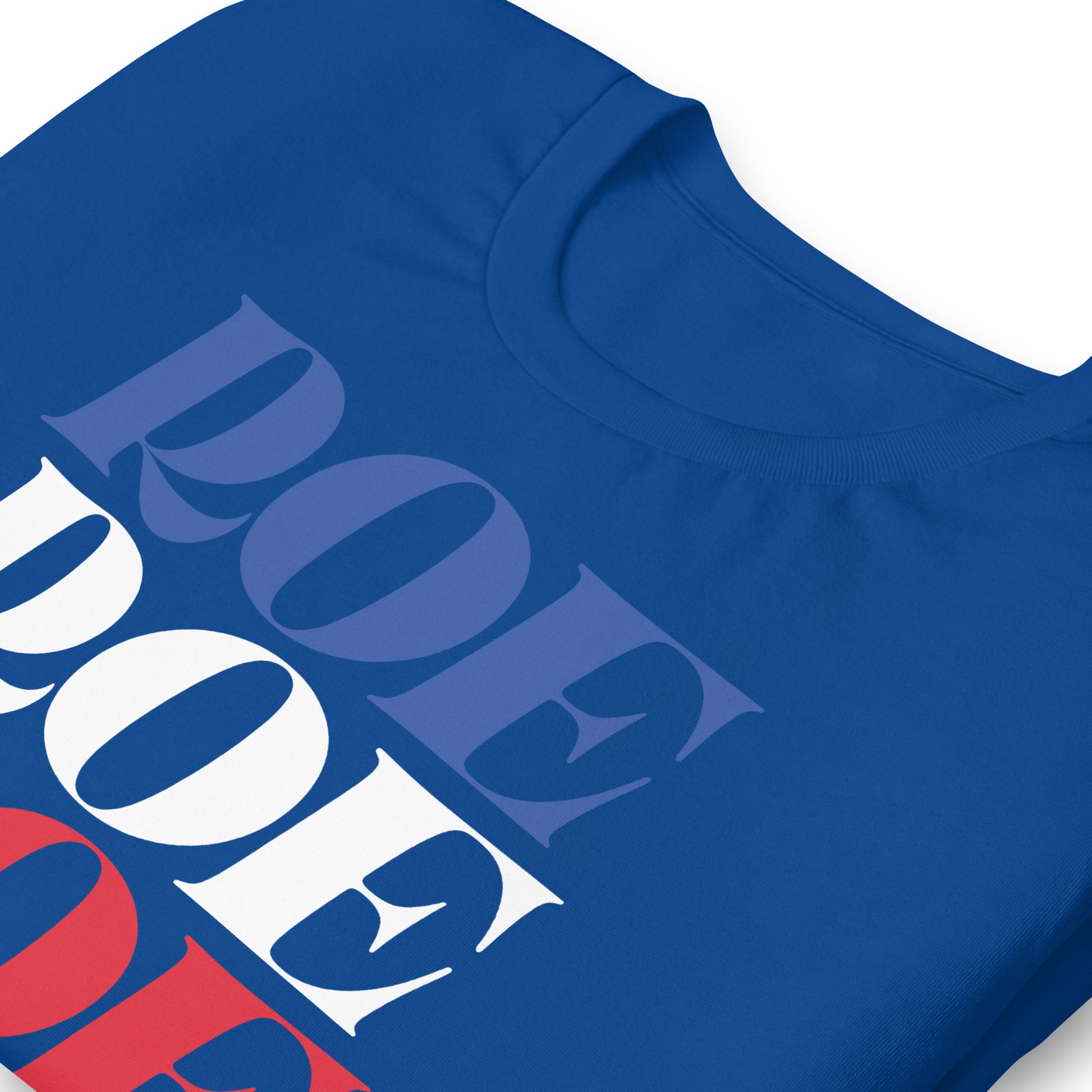 Blue unisex t-shirt close-up featuring large stacked typography reading “Roe Roe Roe Your Vote.”