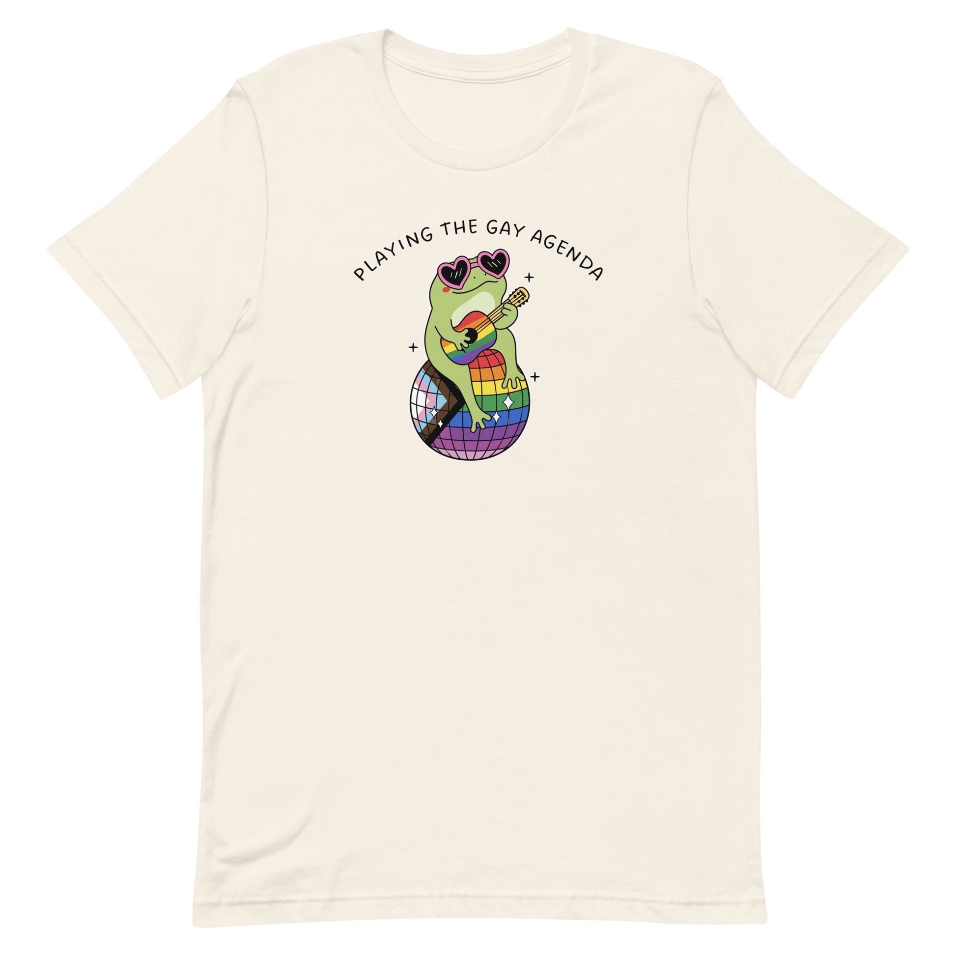 Vintage white unisex t-shirt featuring a disco frog seated on a rainbow disco ball with “Playing the Gay Agenda” text and colorful pride-themed design.