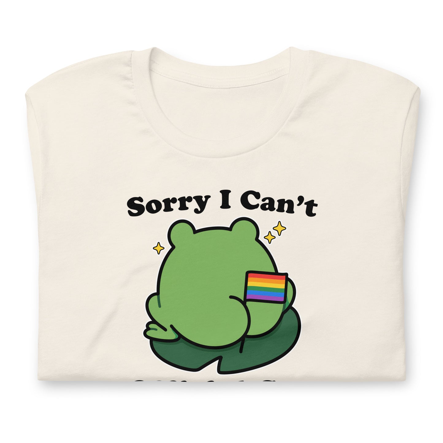 Folded vintage white pride t-shirt displaying a frog holding a rainbow flag with “Official Gay Business” message and lighthearted LGBTQ+ pride-inspired artwork.