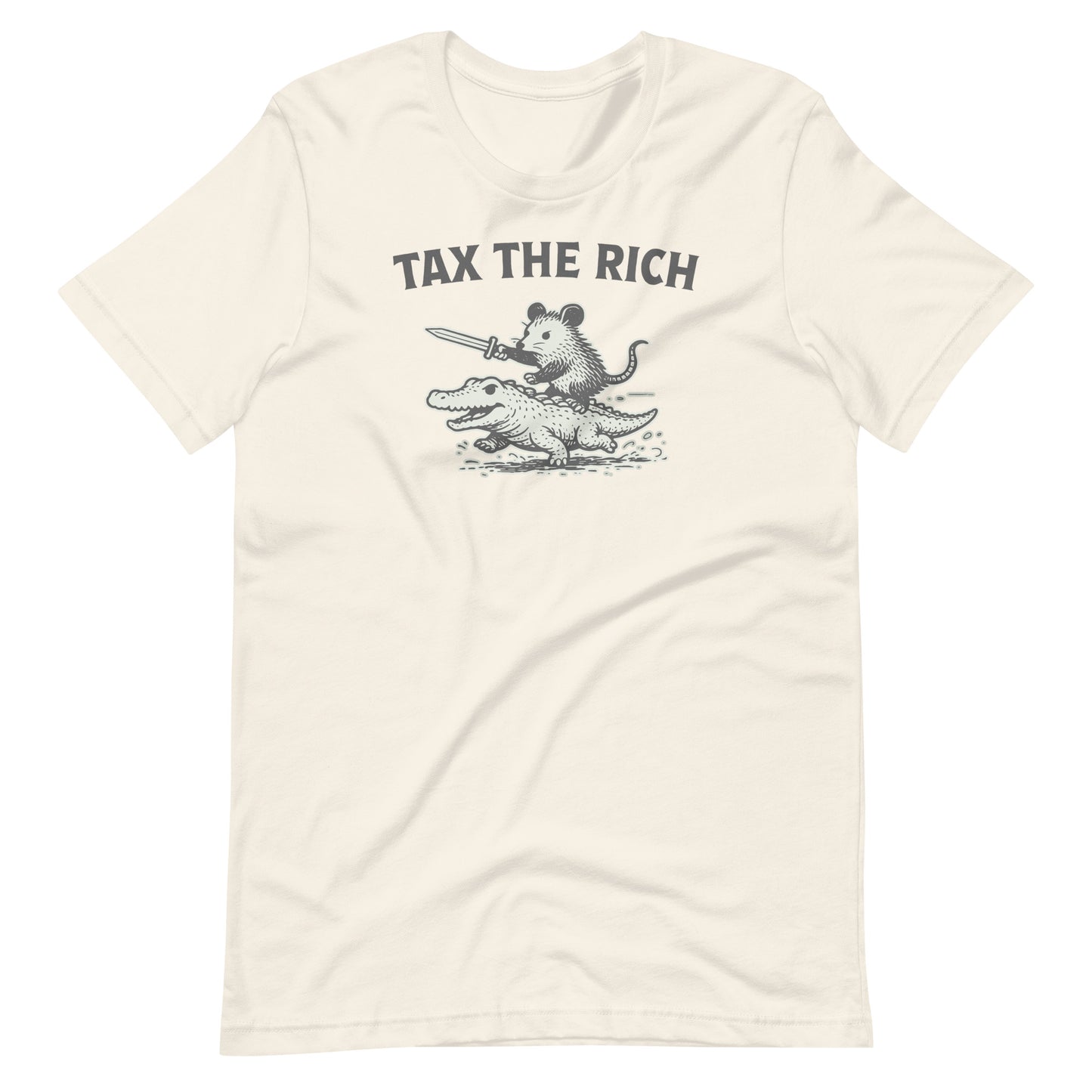 Natural-colored t-shirt showcasing a distressed black-and-white opossum riding an alligator graphic with the phrase “Tax the Rich” in bold typography.