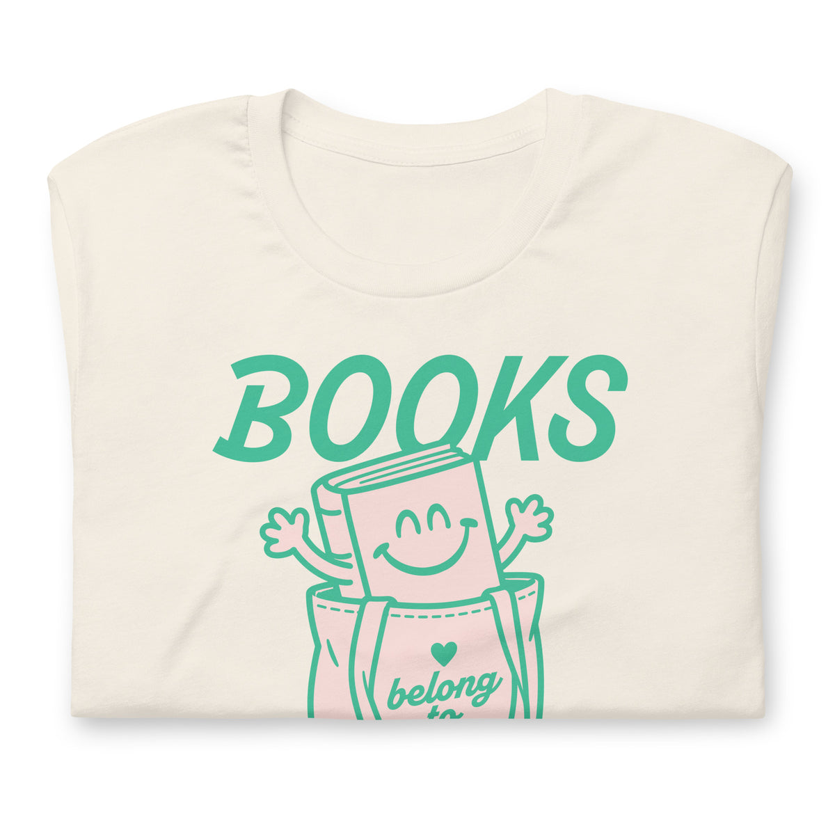 Folded vintage whitel unisex t-shirt showcasing the cheerful book character and teal “Books Belong to Everyone” typography.