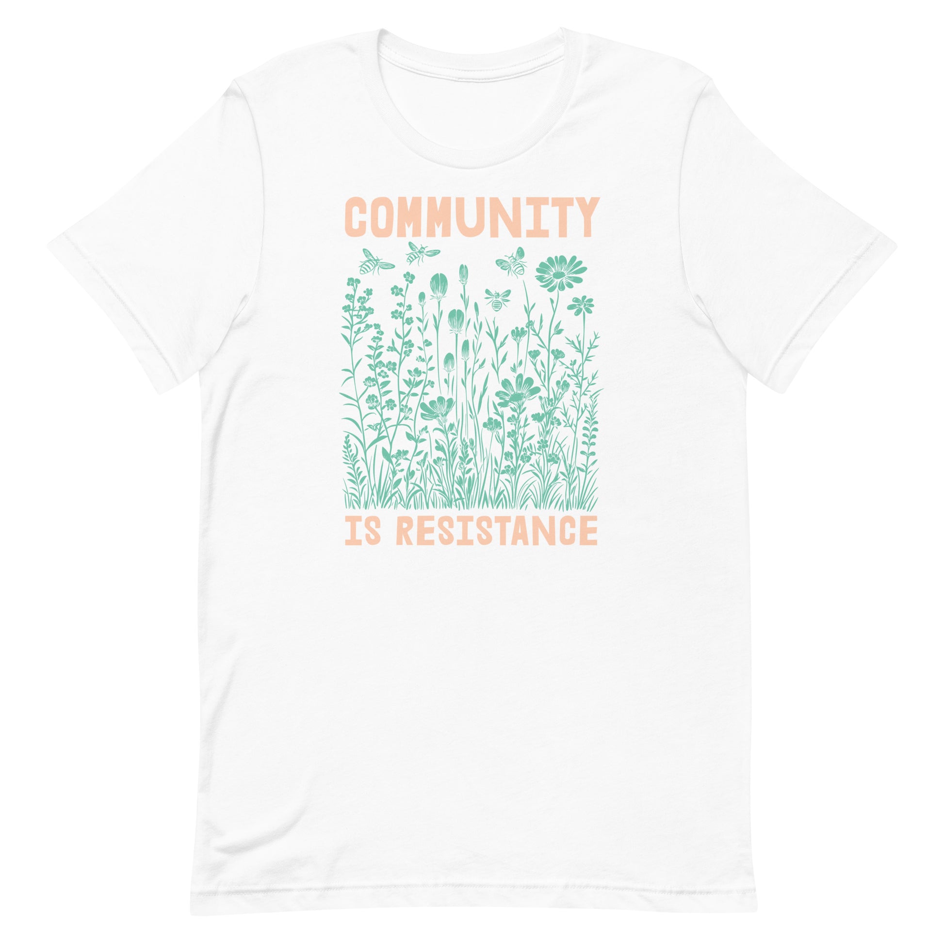 White Community Is Resistance t-shirt featuring pale green floral illustration and peach text. Clean, airy, and expressive of hope, compassion, and change.