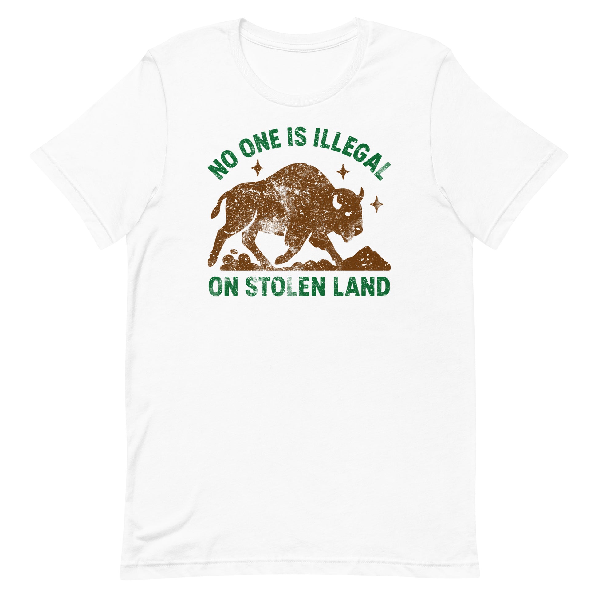 White unisex t-shirt showing the buffalo silhouette and the phrase “NO ONE IS ILLEGAL ON STOLEN LAND,” a clean, high-contrast Indigenous rights message.