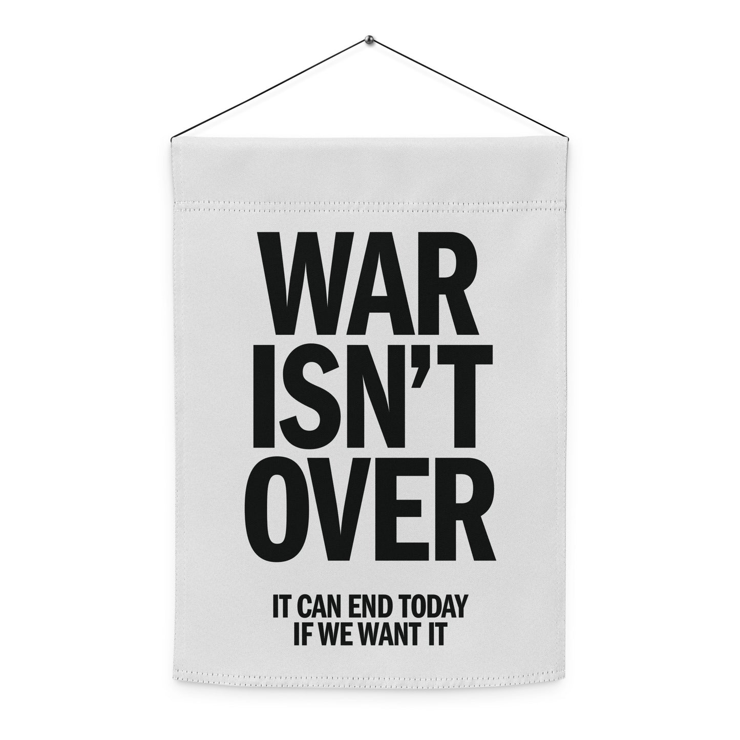 Hanging garden flag featuring bold black anti-war typography reading “WAR ISN’T OVER,” minimalist peace design for justice-focused yard decor.