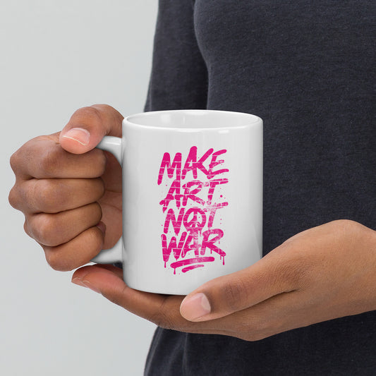 Front View Image: Front view of the 11 oz glossy mug with Make Art Not War graffiti design in pink spray-paint lettering