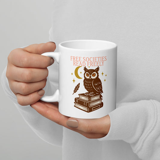 White ceramic mug with “Free Societies Read Freely” owl and books design, literary activism graphic for book lovers.