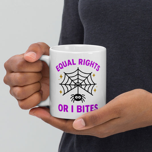 11 oz White ceramic mug with “Equal Rights or I Bites” spider web design, purple text and gold stars, feminist Halloween mug for activists.