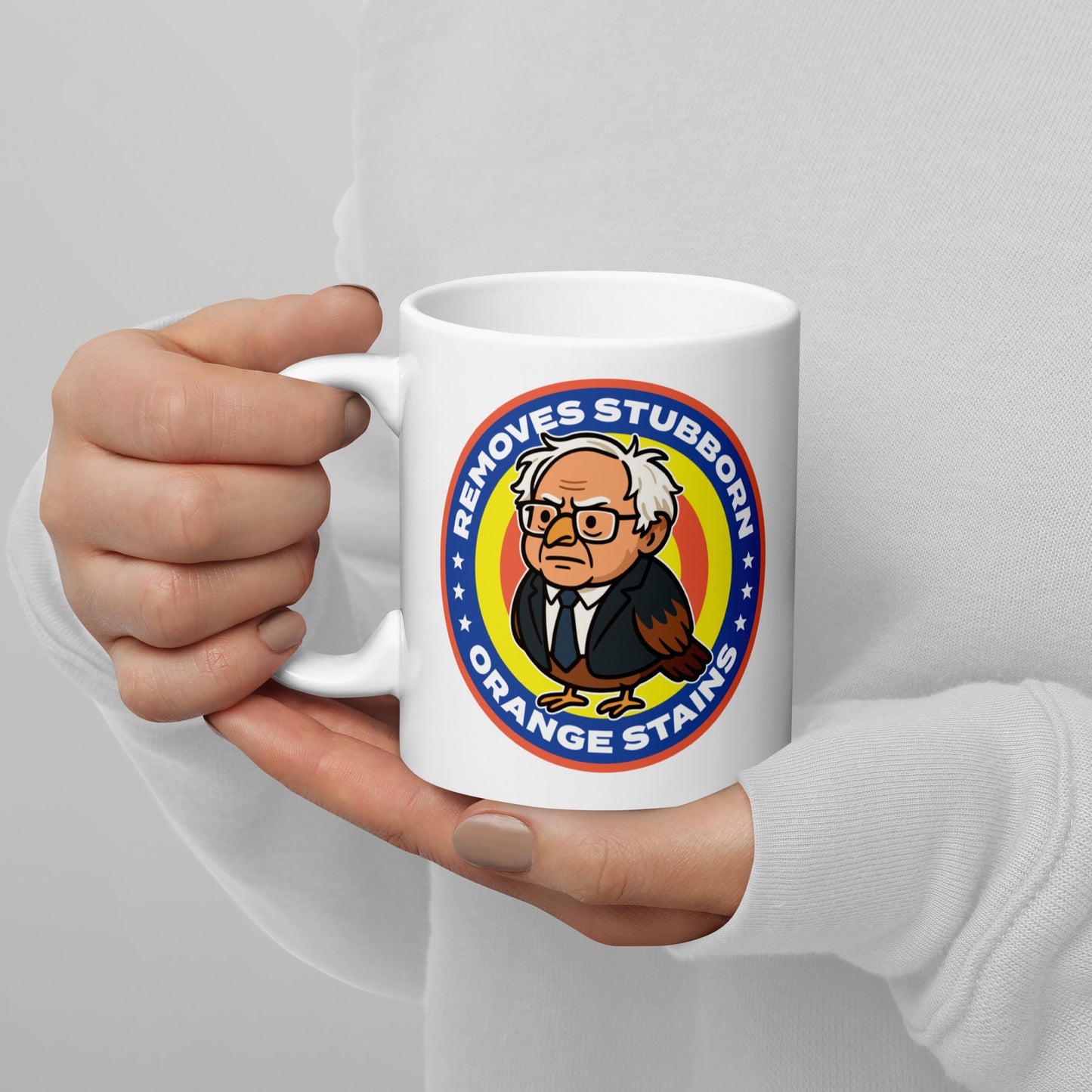 Blue Wave USA ceramic mug held in hand, displaying circular Birdie Sanders cleaning parody logo with orange stains wording.