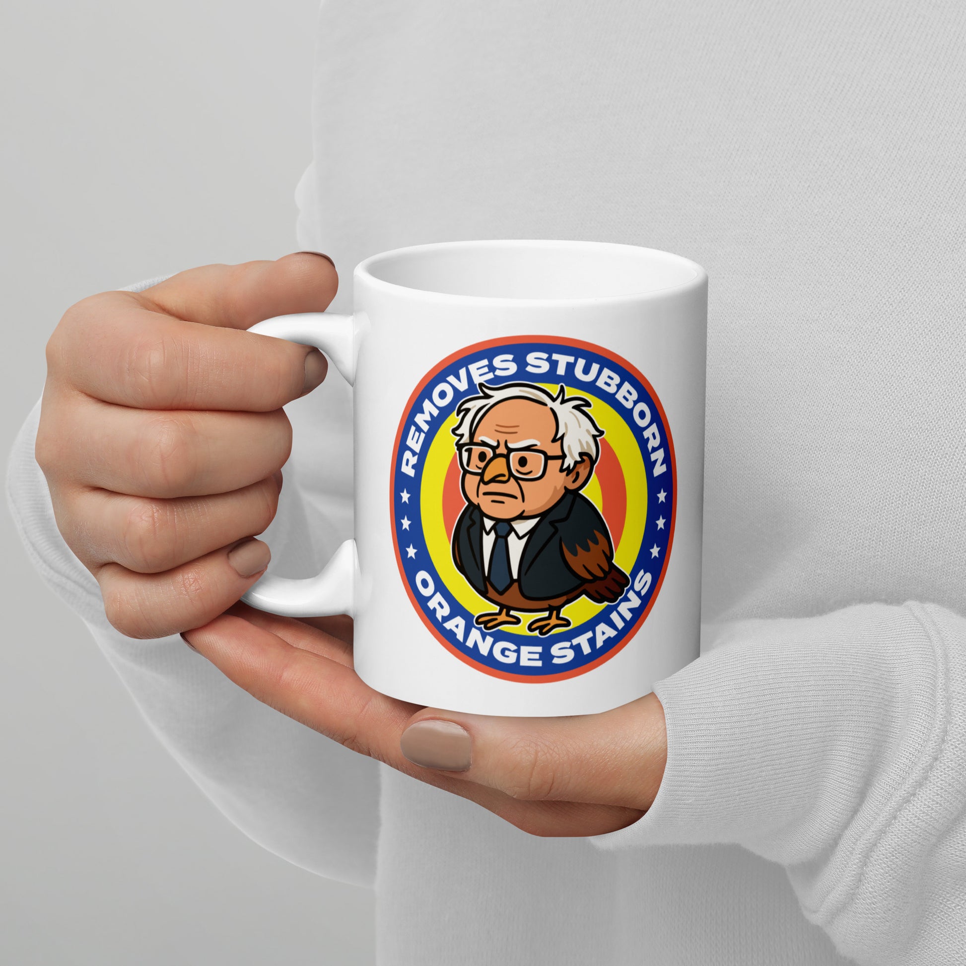 Blue Wave USA ceramic mug held in hand, displaying circular Birdie Sanders cleaning parody logo with orange stains wording.