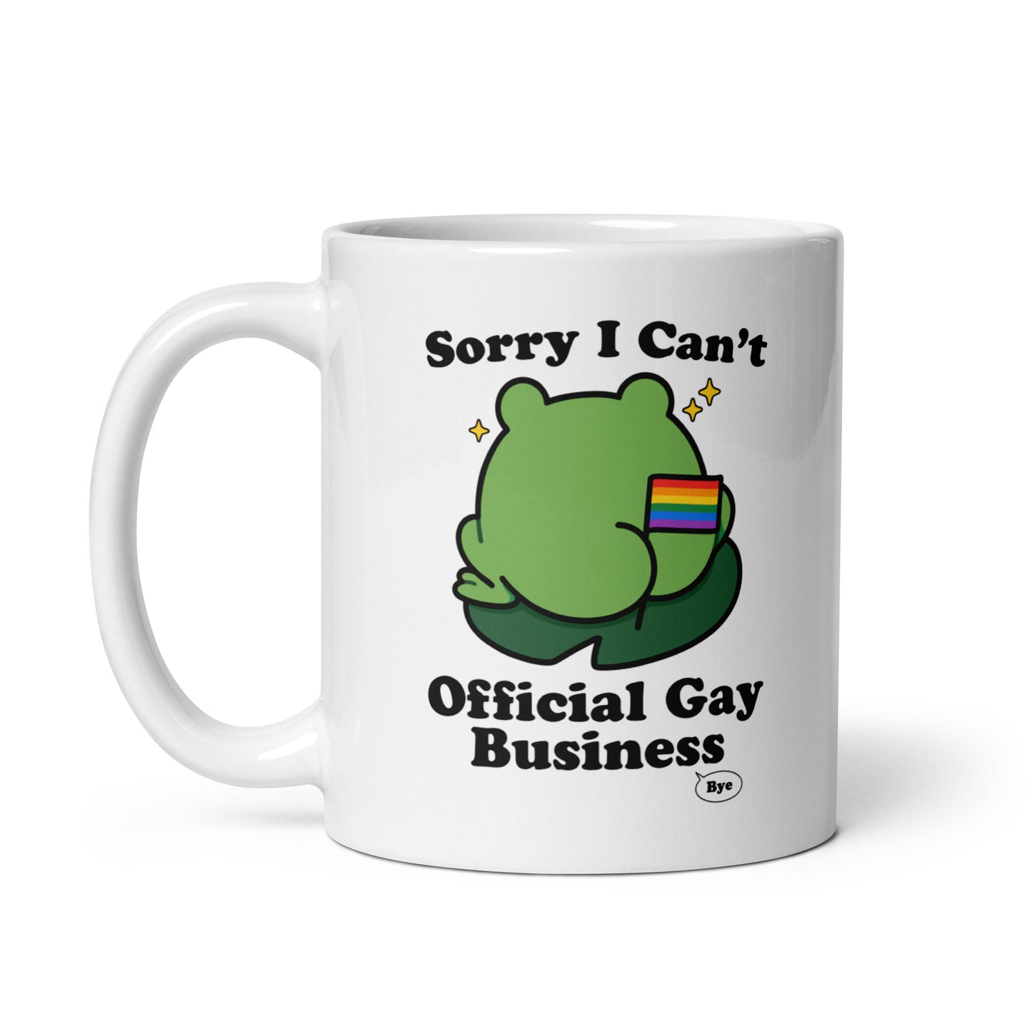 White ceramic mug displaying a cartoon frog with rainbow flag detail and humorous “Official Gay Business” message celebrating queer joy and self-expression.