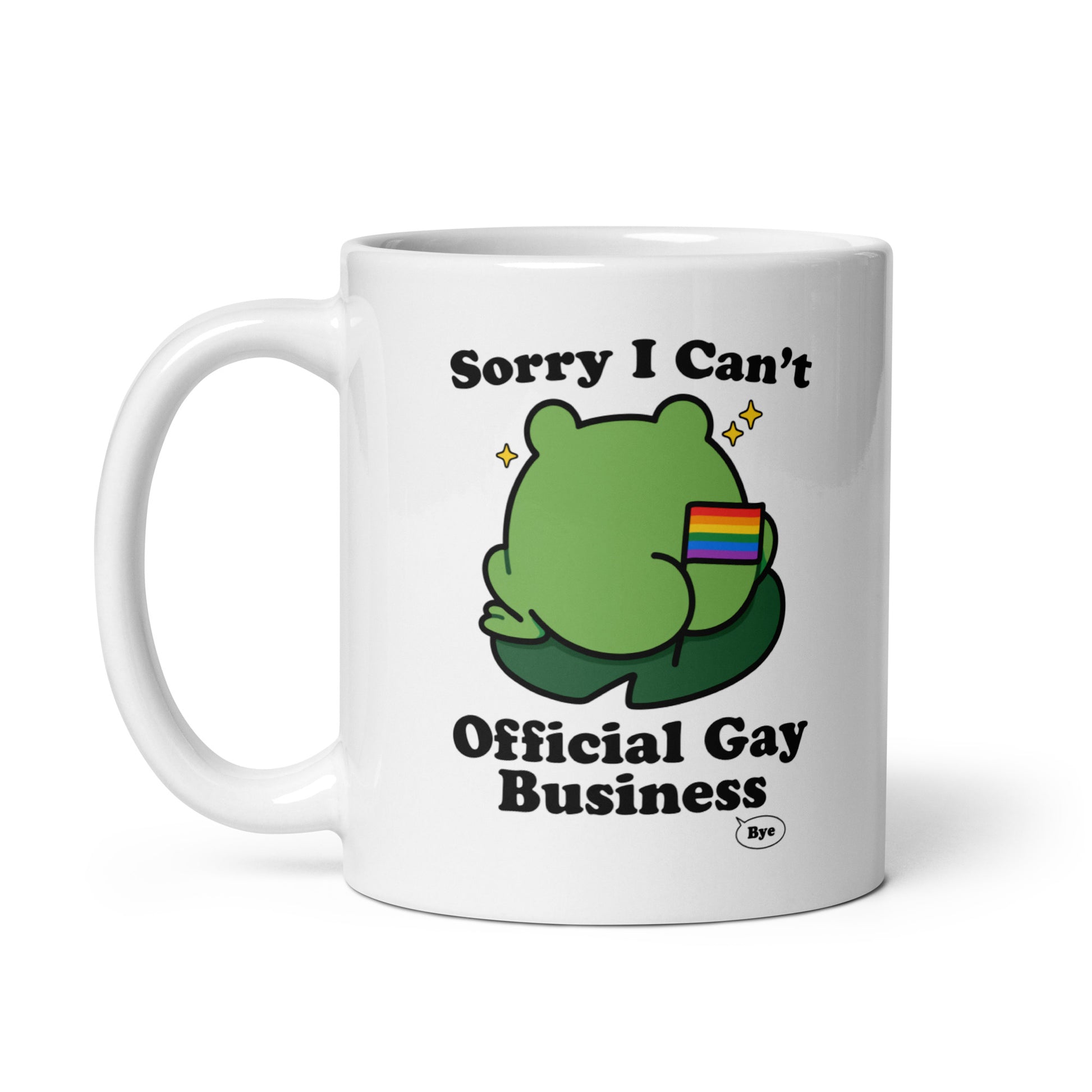 White ceramic mug displaying a cartoon frog with rainbow flag detail and humorous “Official Gay Business” message celebrating queer joy and self-expression.