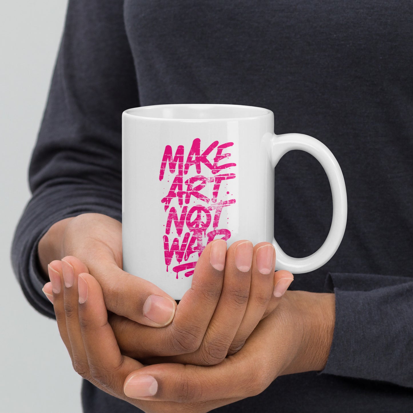Front View Image: Front view of the 11 oz glossy mug with Make Art Not War graffiti design in pink spray-paint lettering