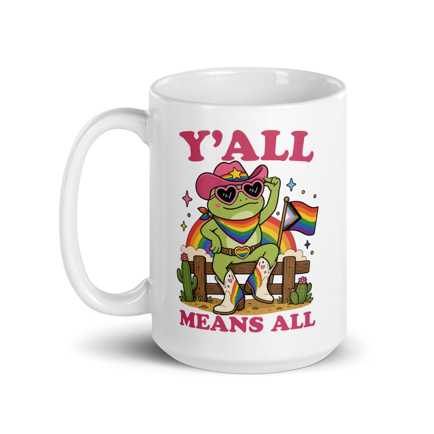 White mug featuring vibrant rainbow cowboy frog artwork and bold “Y’All Means All” typography promoting inclusion, equality, and LGBTQ+ community pride.