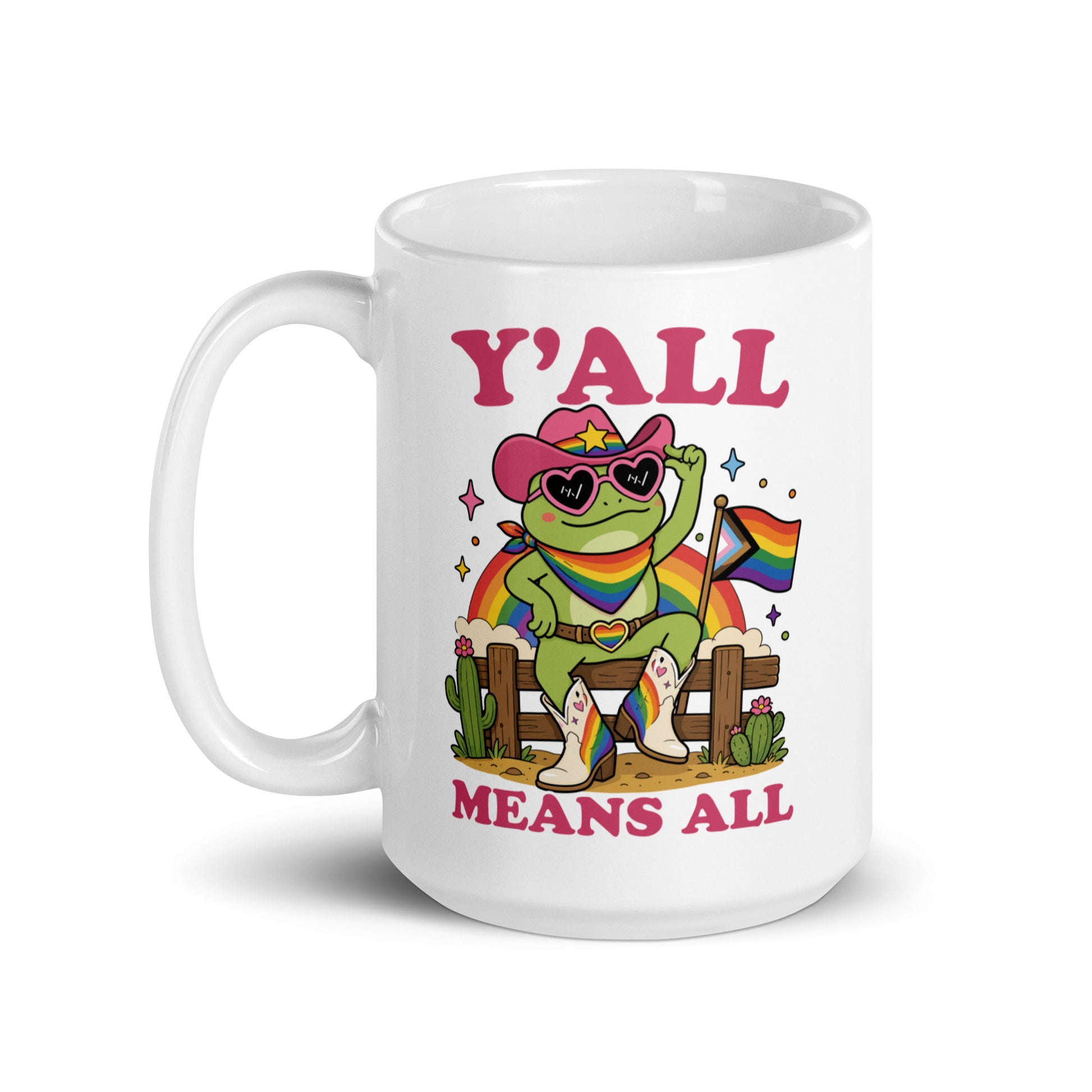 White mug featuring vibrant rainbow cowboy frog artwork and bold “Y’All Means All” typography promoting inclusion, equality, and LGBTQ+ community pride.