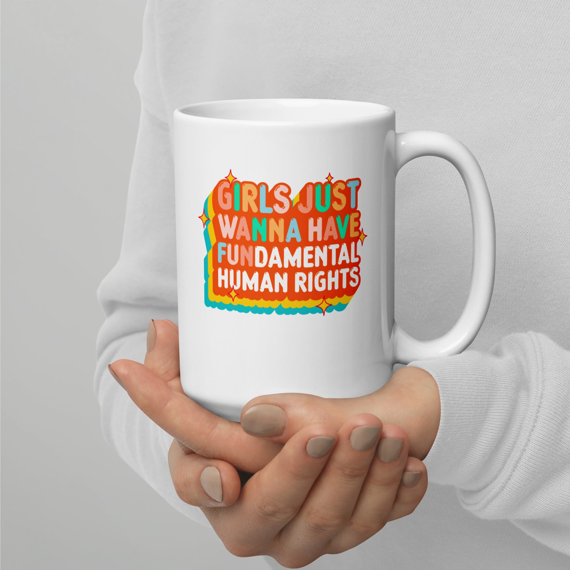 15 oz white ceramic mug with the groovy retro feminist “Girls Just Wanna Have Fundamental Human Rights” print, everyday advocacy by Blue Wave USA.