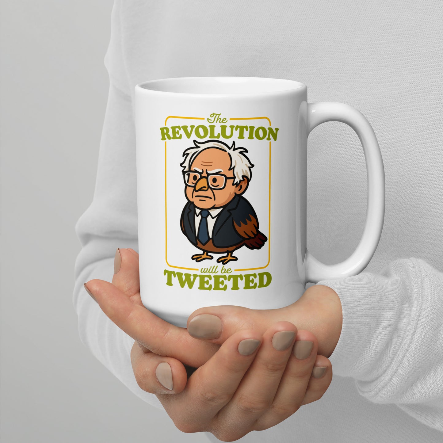 Ceramic mug mockup showing cartoon Birdie Sanders artwork with retro revolution wording and tweeted slogan in clean activist gift design.