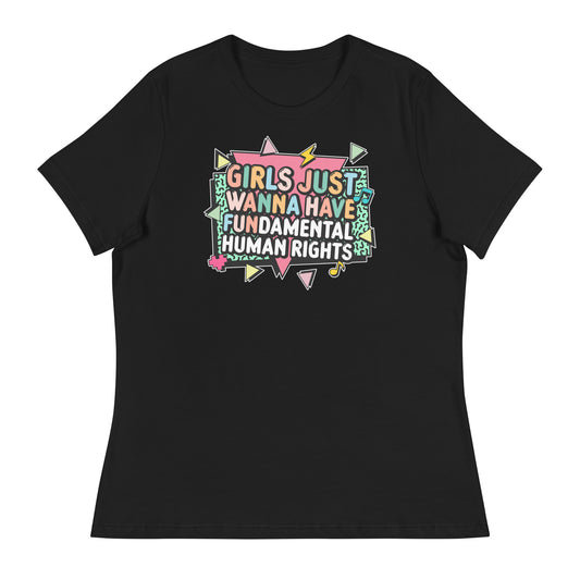 Black women’s relaxed-fit t-shirt featuring the retro slogan “Girls Just Wanna Have Fundamental Human Rights” in bright pastel lettering with geometric accents. Feminist statement tee by Blue Wave USA.