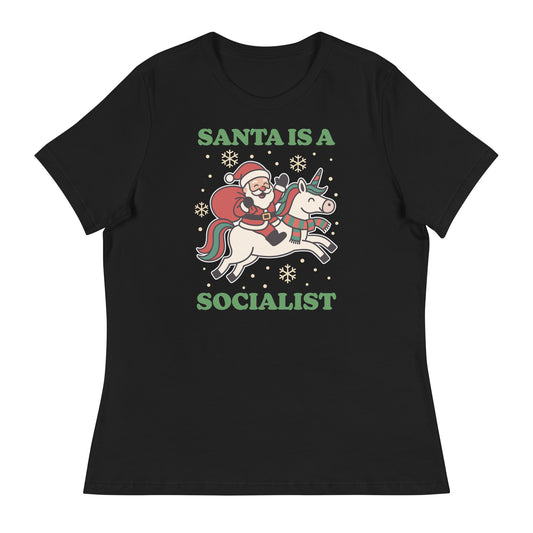 Black women’s relaxed t-shirt featuring a retro Santa riding a unicorn with holiday stars and the printed message “SANTA IS A SOCIALIST” in green lettering.