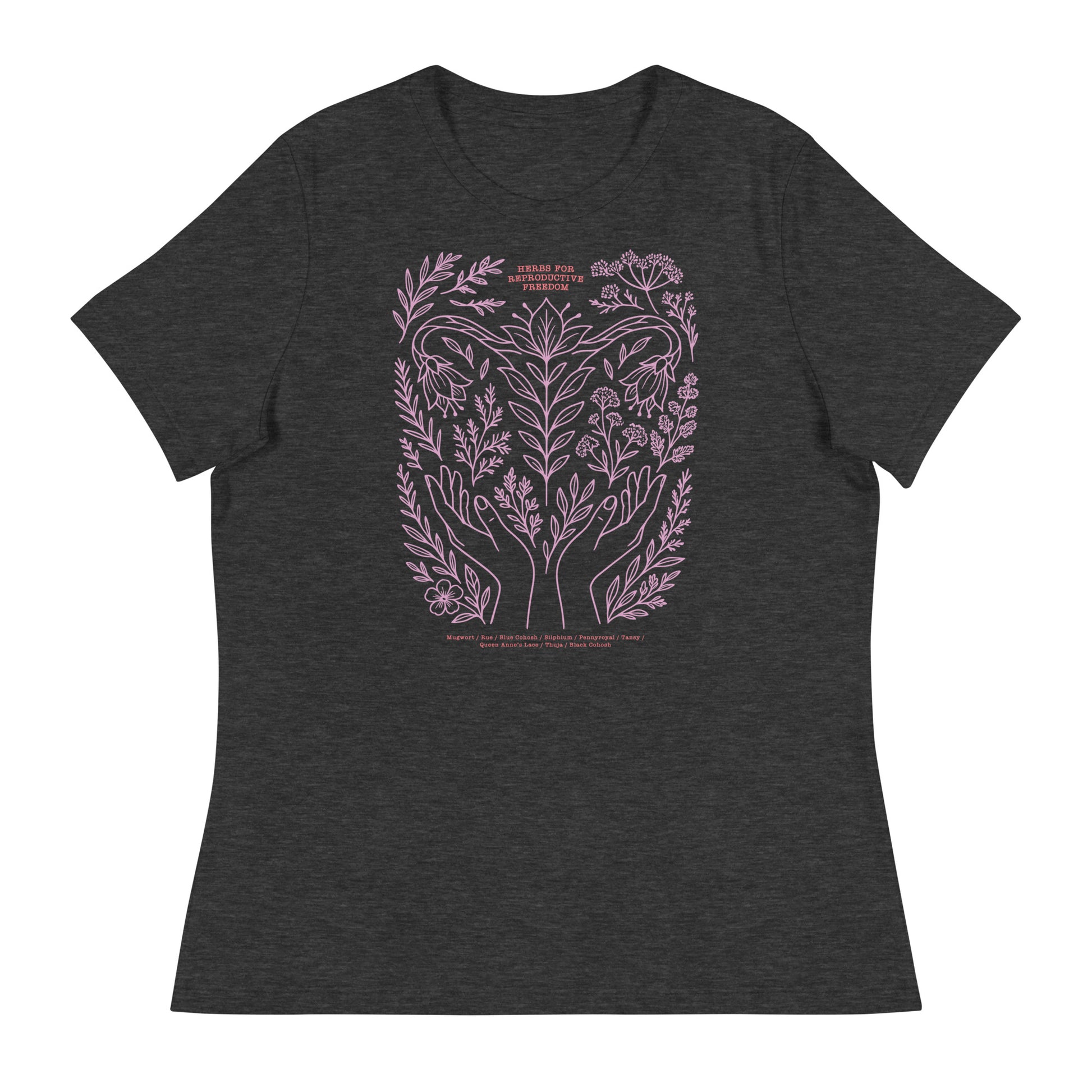 Dark heather gray relaxed tee featuring lavender botanical line art and the phrase “Herbs for Reproductive Freedom,” listing herbs such as mugwort, rue, and blue cohosh.
