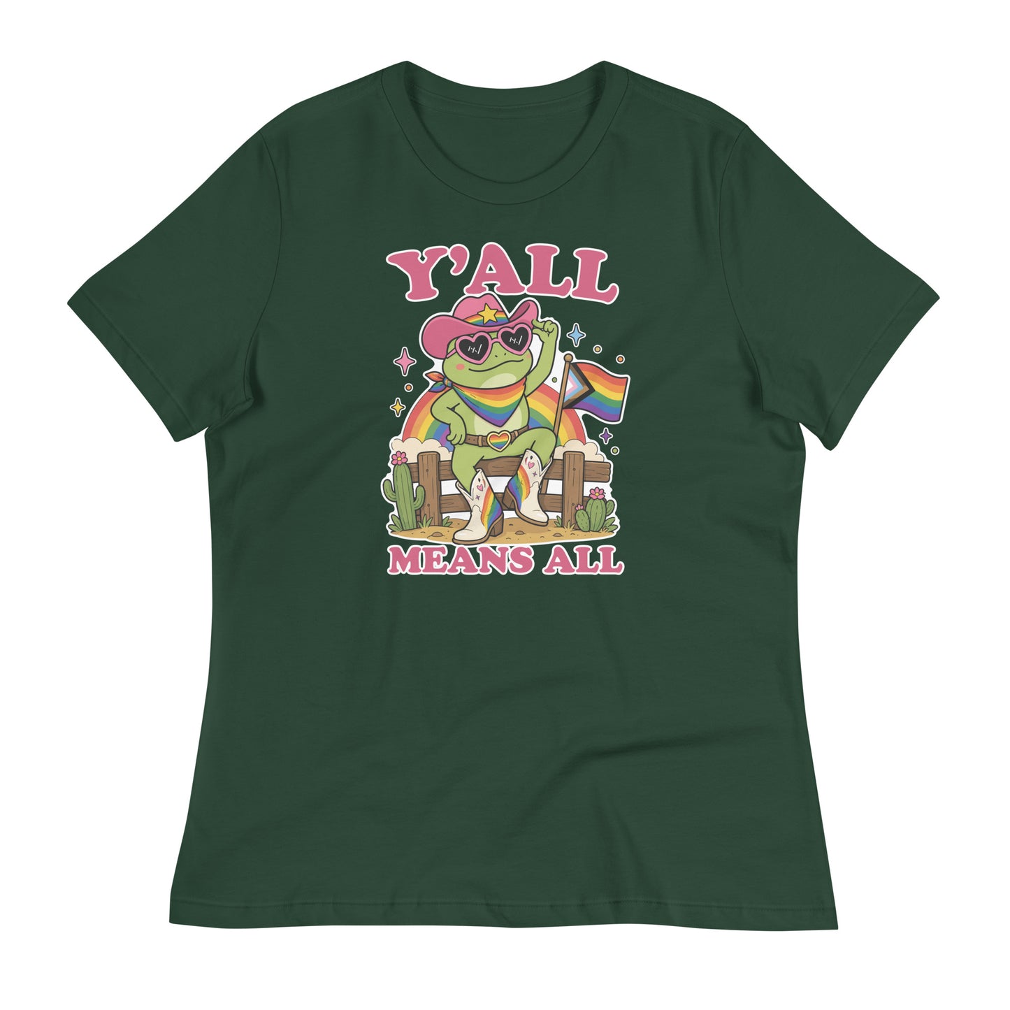 Green women’s relaxed t-shirt displaying colorful cowboy frog artwork with rainbow pride flag accents and welcoming “Y’All Means All” typography.