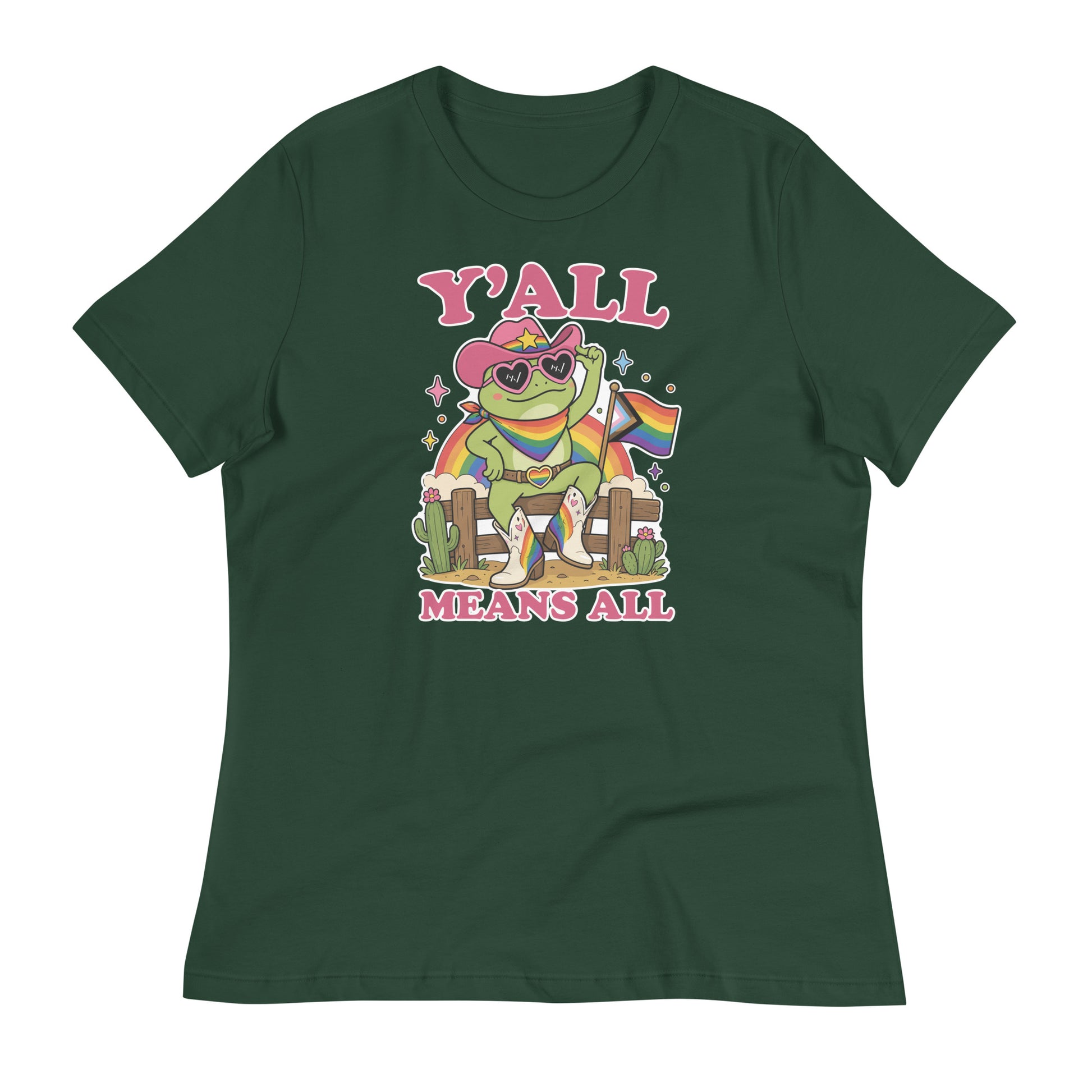 Green women’s relaxed t-shirt displaying colorful cowboy frog artwork with rainbow pride flag accents and welcoming “Y’All Means All” typography.