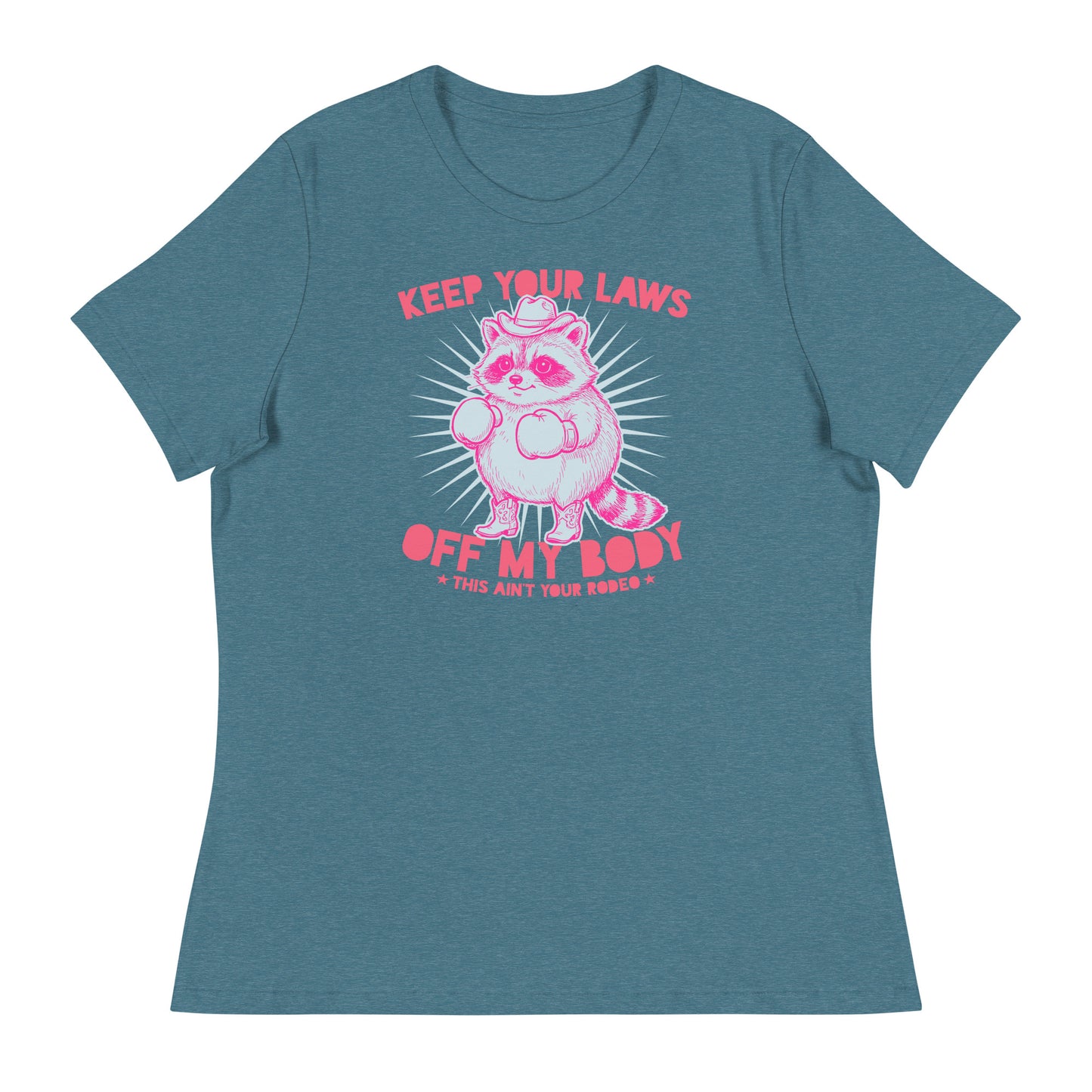 Blue heather women’s relaxed tee with cowboy raccoon graphic and “Keep Your Laws Off My Body” slogan in bold feminist apparel design.