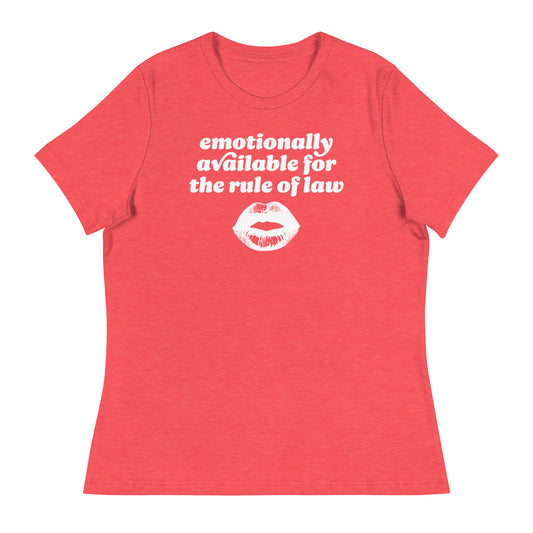 Heather red women’s relaxed t-shirt featuring bold rounded text and kiss illustration reading “emotionally available for the rule of law,” a modern activist Valentine statement.