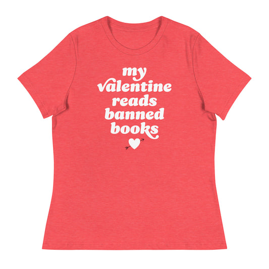 Women’s relaxed t-shirt in coral displaying “my valentine reads banned books” in retro lettering with heart detail, progressive Valentine apparel from Blue Wave USA.