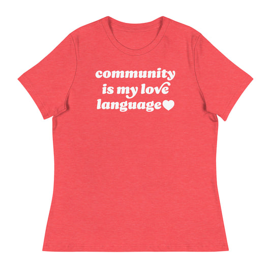 Women’s relaxed red t-shirt showcasing bold retro text “community is my love language” with heart detail, justice-focused design by Blue Wave USA for Valentine’s Day.