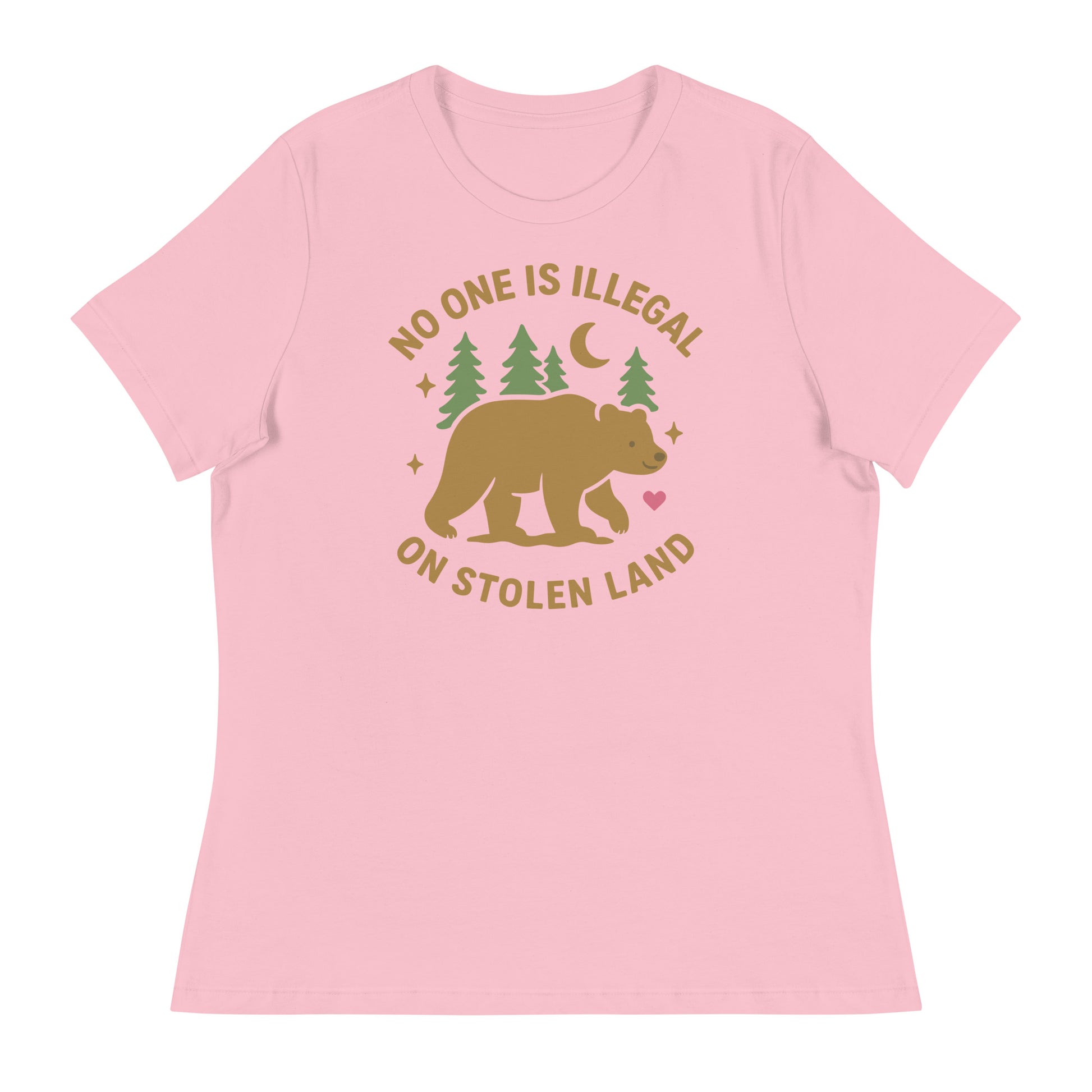 Light pink women’s relaxed t-shirt with the tan bear, forest, heart, and moon illustration and the printed message “NO ONE IS ILLEGAL ON STOLEN LAND,” a gentle Indigenous-rights design from Blue Wave USA.