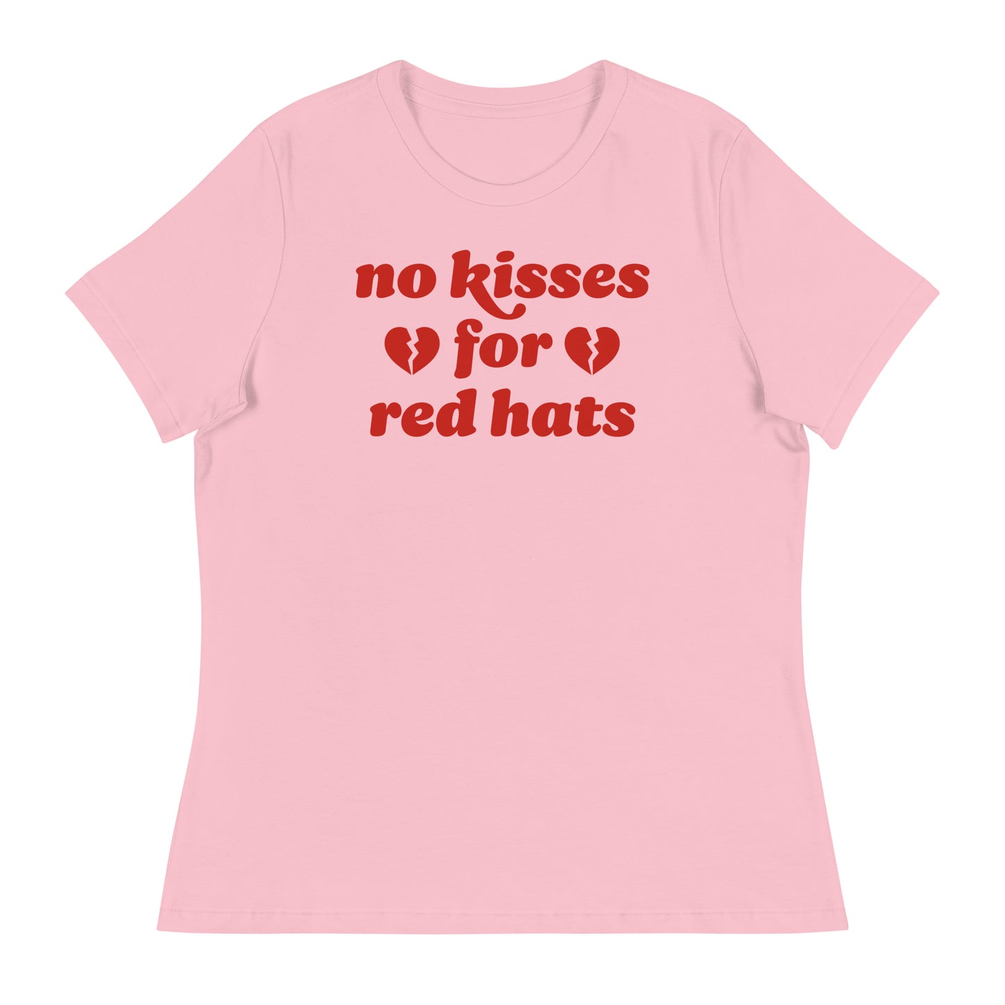 Women’s relaxed t-shirt in soft pink featuring the phrase “no kisses for red hats” with broken heart icons, an anti-MAGA progressive Valentine design.