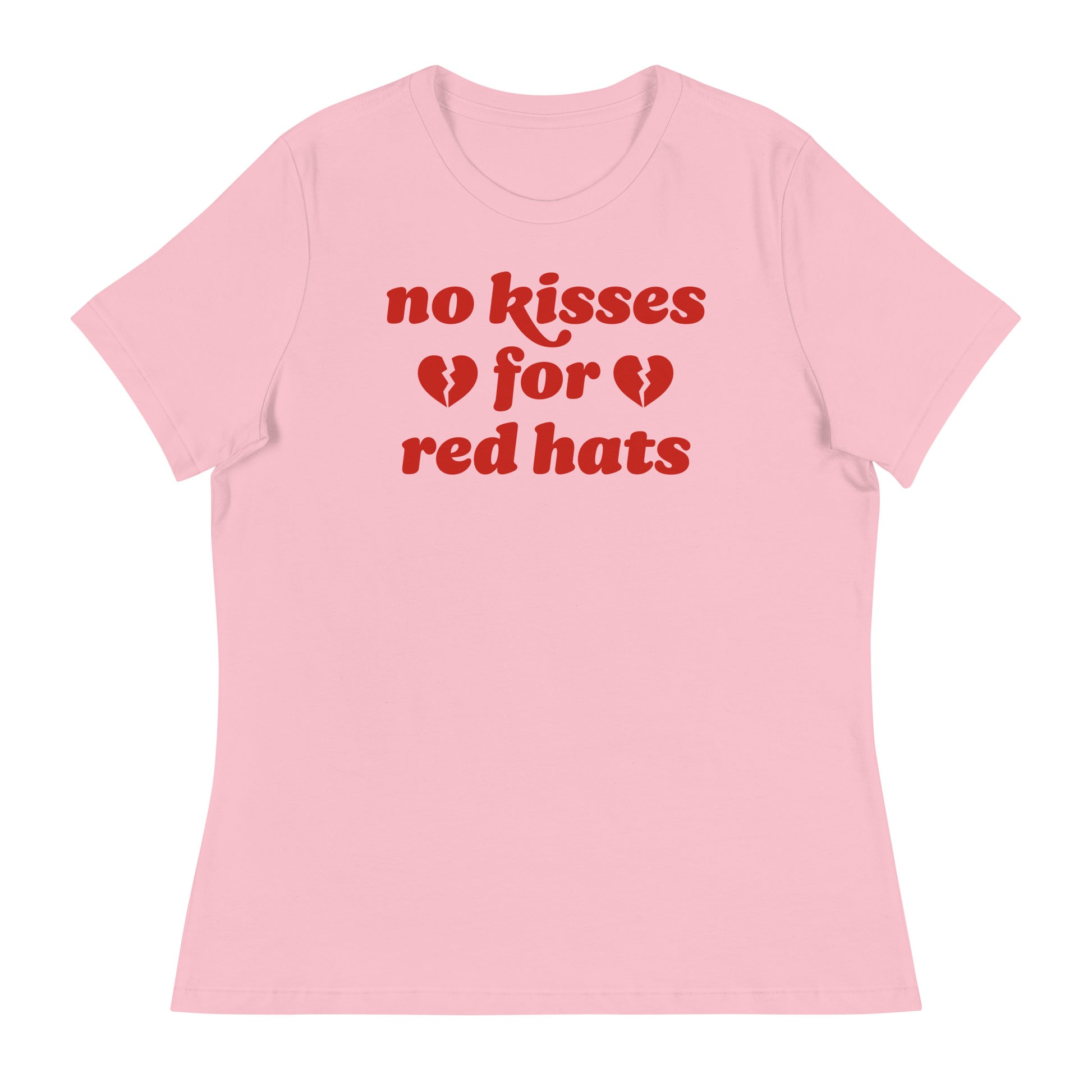 Women’s relaxed t-shirt in soft pink featuring the phrase “no kisses for red hats” with broken heart icons, an anti-MAGA progressive Valentine design.