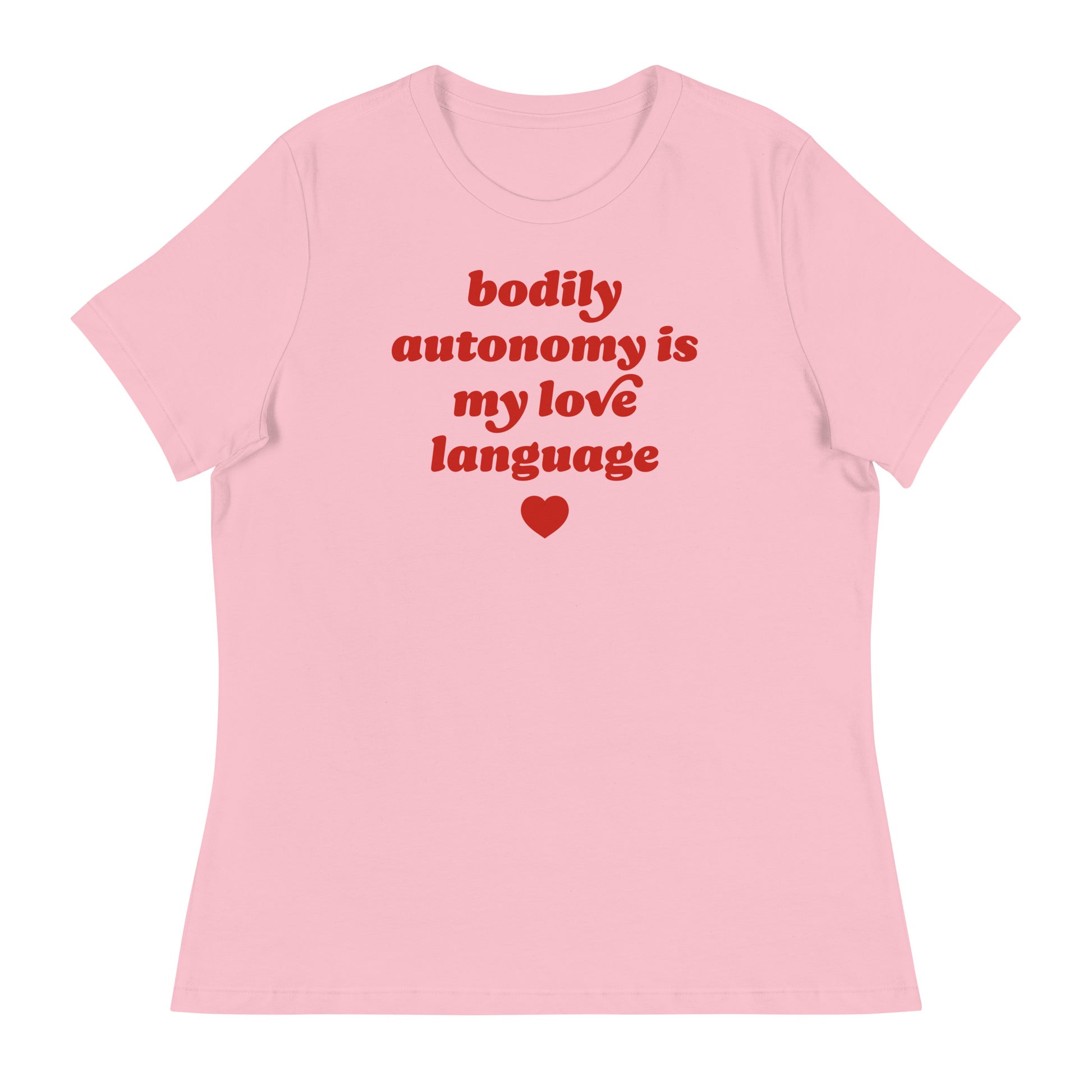 Women’s relaxed t-shirt in soft pink featuring retro red typography and heart graphic reading “bodily autonomy is my love language,” a progressive Valentine justice-focused design.