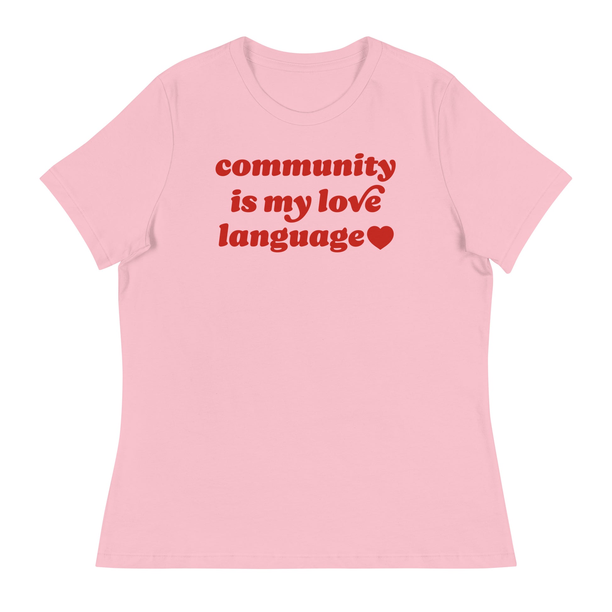 Women’s relaxed t-shirt in soft pink featuring retro red typography and heart icon reading “community is my love language,” a progressive Valentine design centered on political activism.