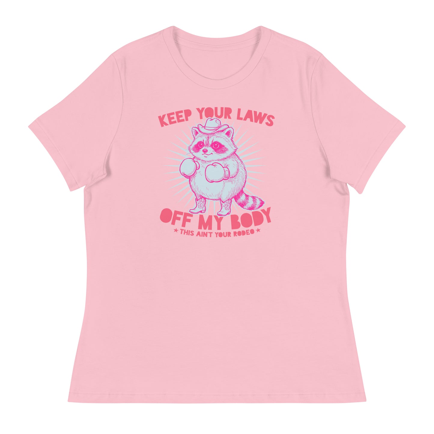 Pink women’s relaxed tee featuring cowboy raccoon artwork with “Keep Your Laws Off My Body” phrase in soft feminist activist apparel.