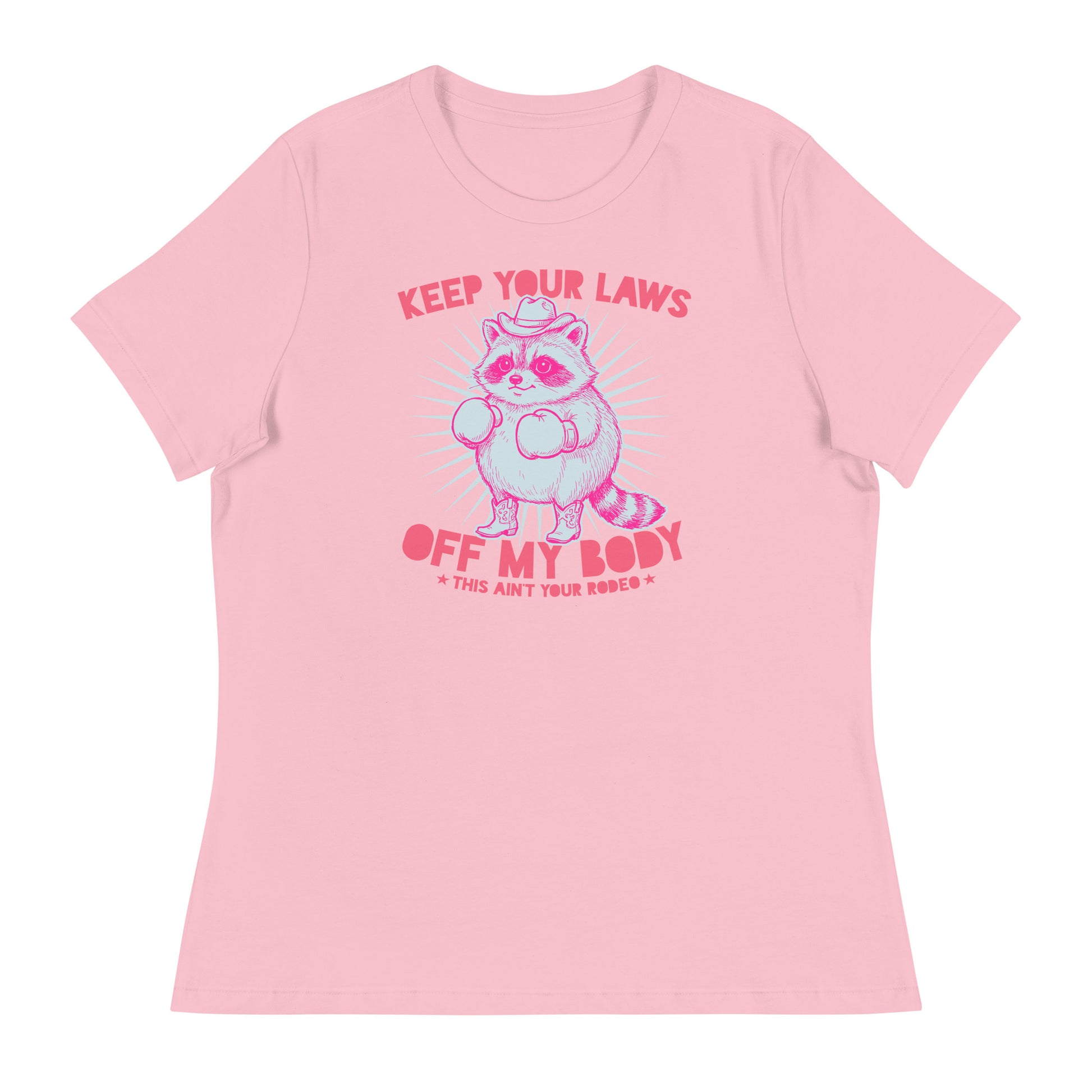 Pink women’s relaxed tee featuring cowboy raccoon artwork with “Keep Your Laws Off My Body” phrase in soft feminist activist apparel.