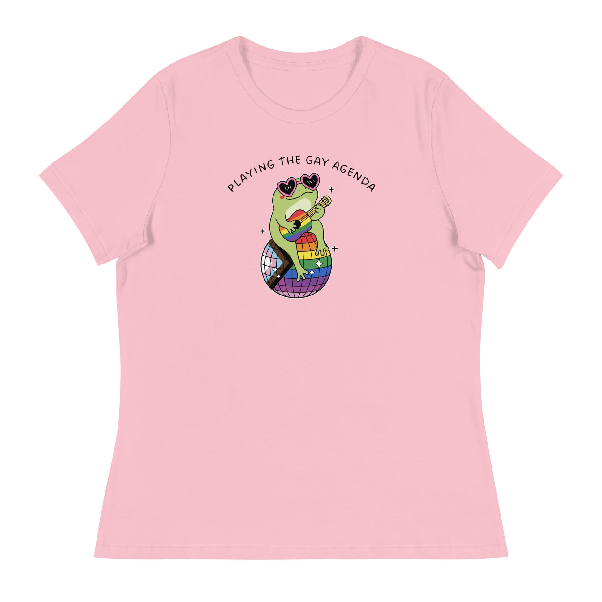 Pink women’s relaxed t-shirt showcasing a frog playing guitar on a rainbow disco ball with vibrant LGBTQ+ pride artwork and retro disco vibes.