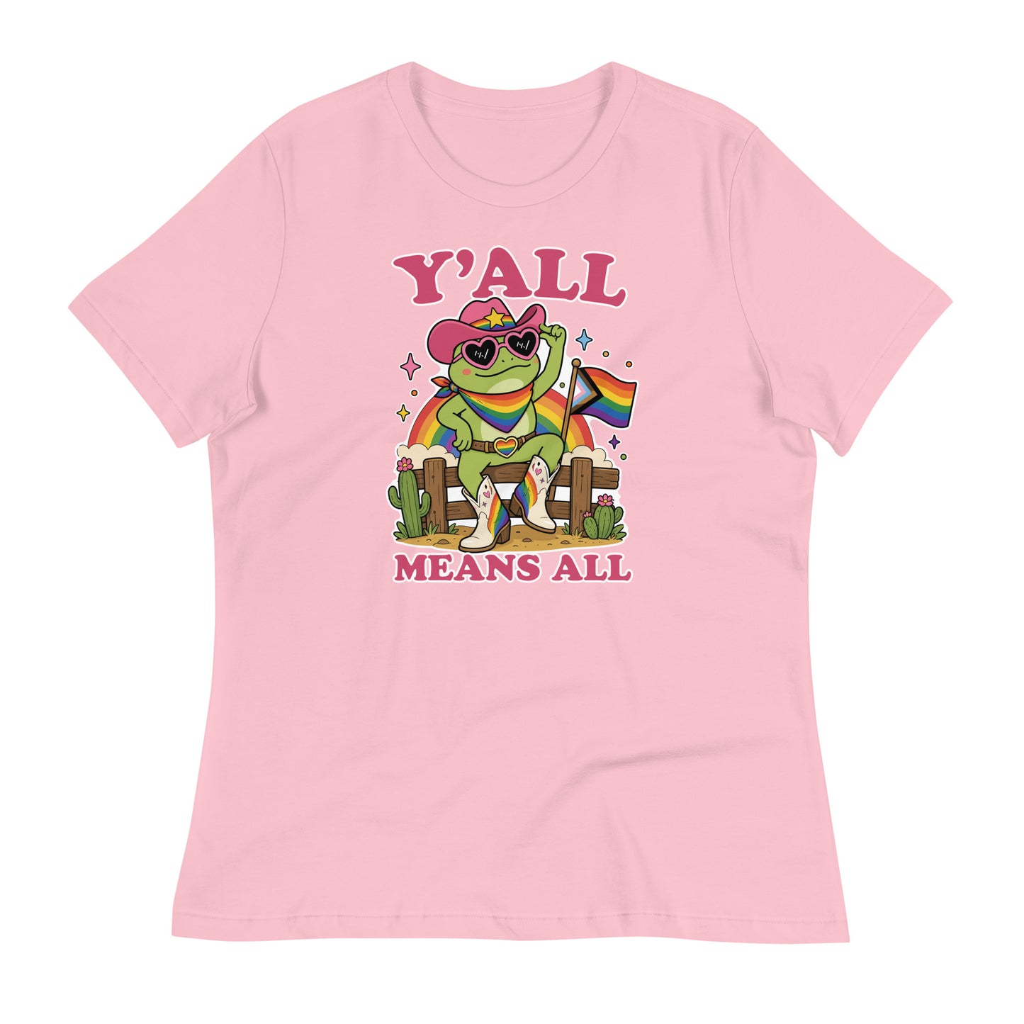 Pink women’s relaxed t-shirt showcasing a cheerful cowboy frog holding a rainbow pride flag with colorful “Y’All Means All” LGBTQ+ pride artwork.