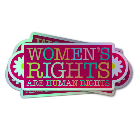Holographic sticker with “Women’s Rights Are Human Rights” in rainbow letters, framed by white daisies on a pink background.